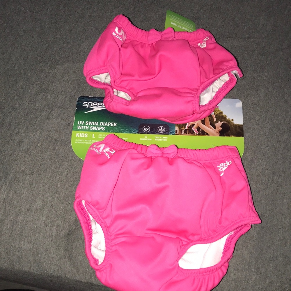 Swim diaper w/snap side. Speedo. $25 for both.